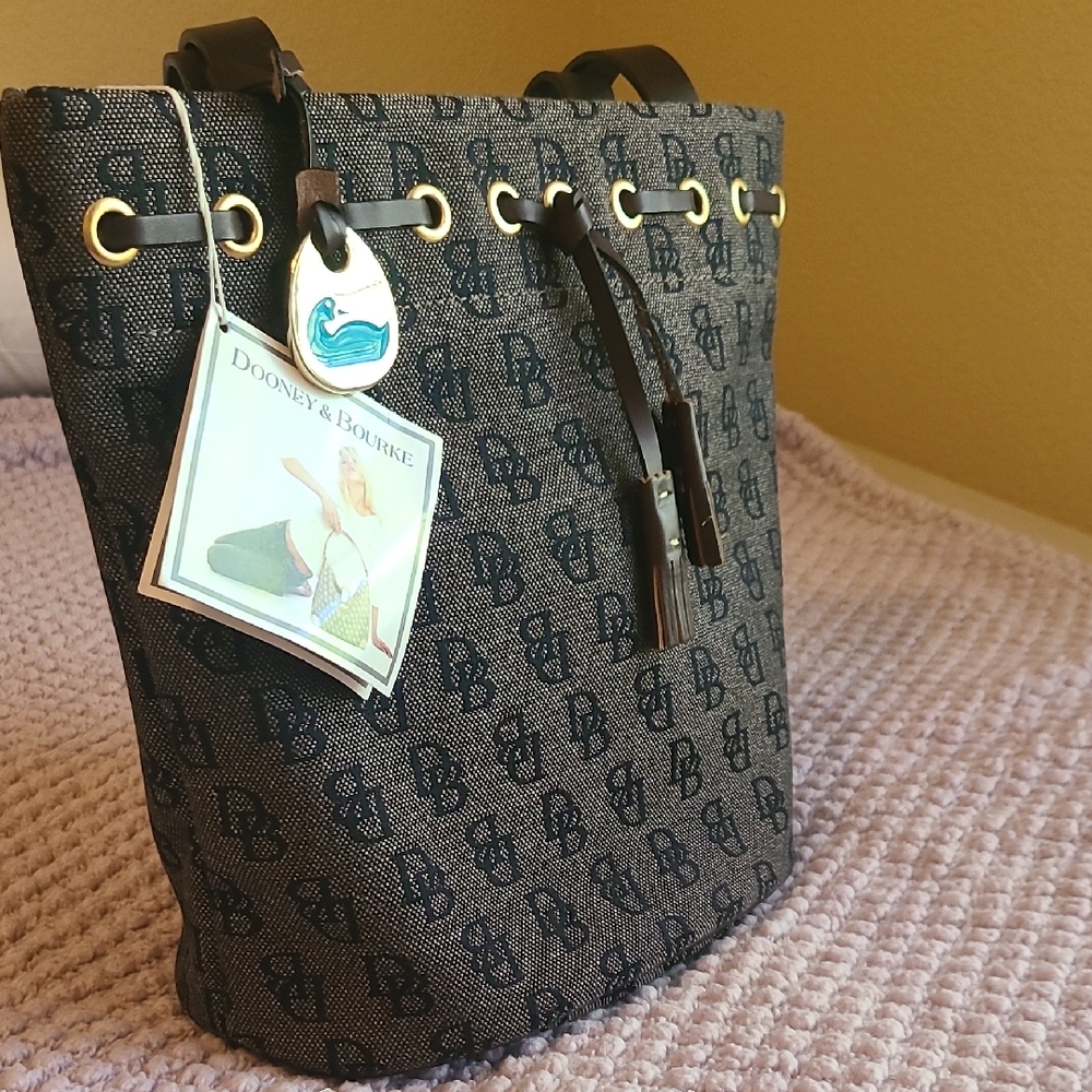 Dooney & Bourke Black and Brown Monogram - Medium Tassle Bucket Bag